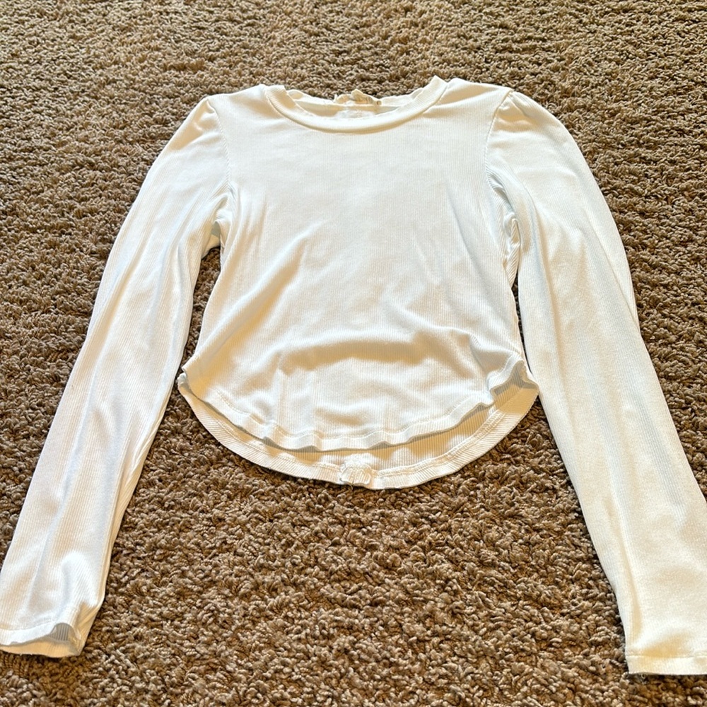 White. Cropped, fitted long sleeve top
